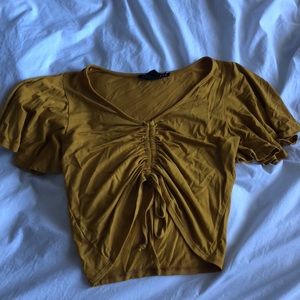 Mustard yellow drawstring crop top